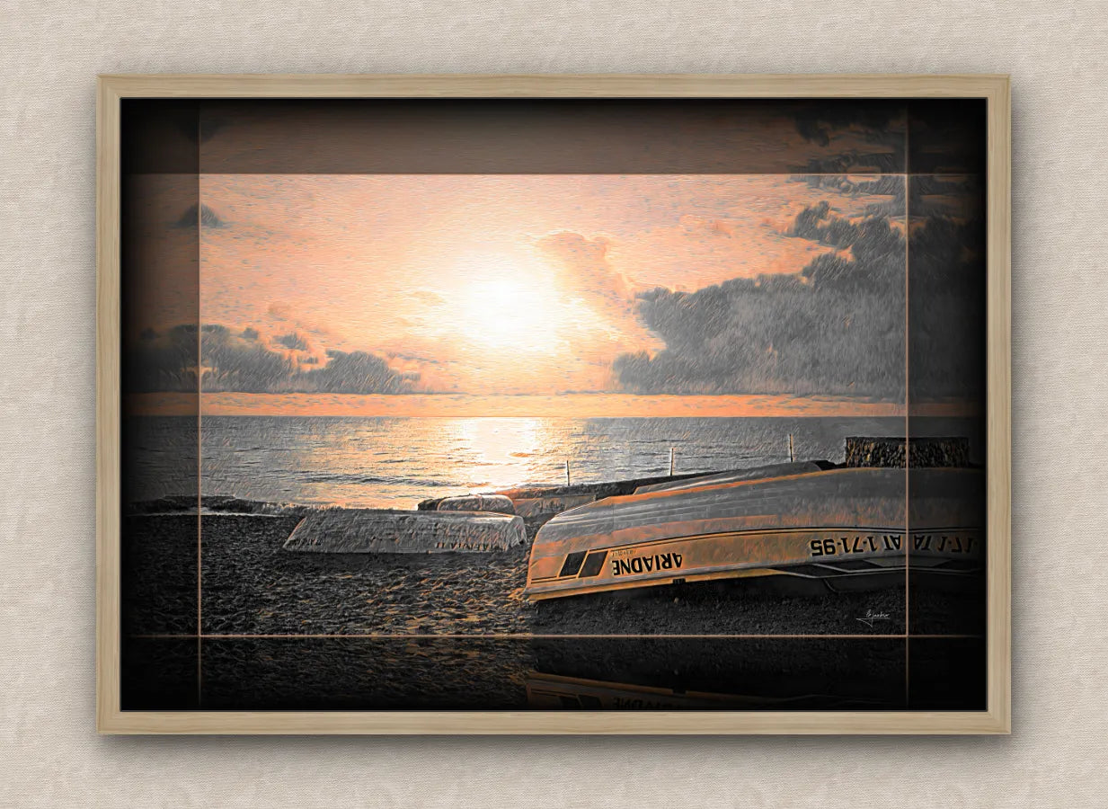 Landscape artwork of an old sea pier, boats and beach; with dark borders and oak frame, on a beige wall