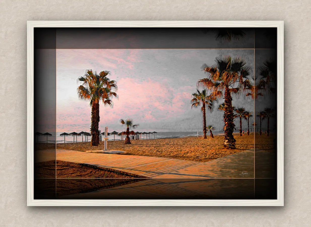 Landscape artwork of a beach and palm trees; with dark borders and white frame, on a beige wall