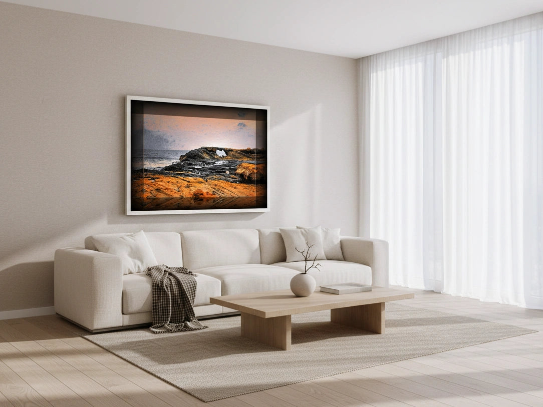Modern living room with a white sofa, coffee table, and wall art.