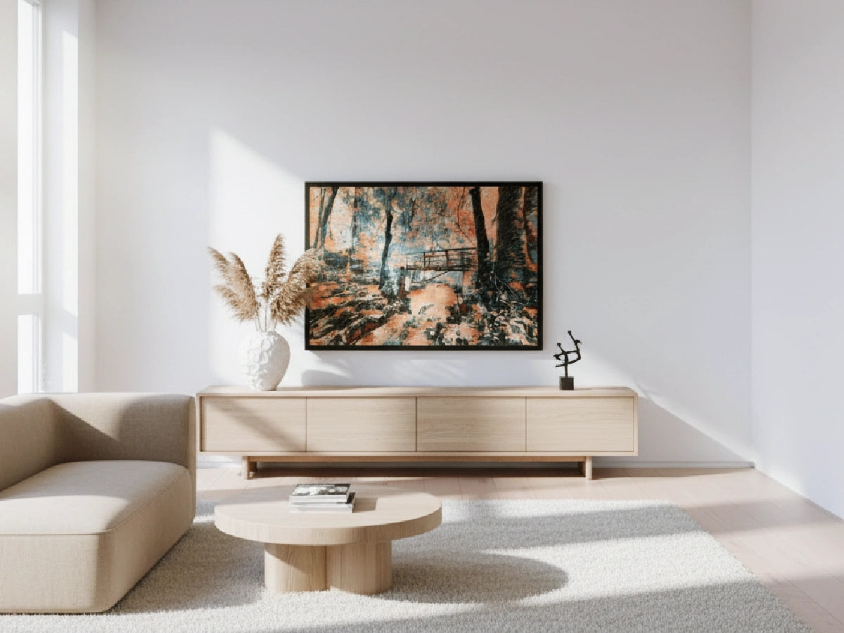 Modern living room with a framed landscape picture on the wall, a beige sofa, and a coffee table.