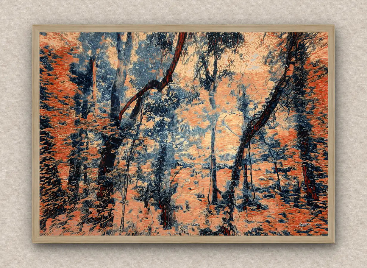 Oak framed artwork of an eerie forest scene with exuberant trees and foliage in dark orange.