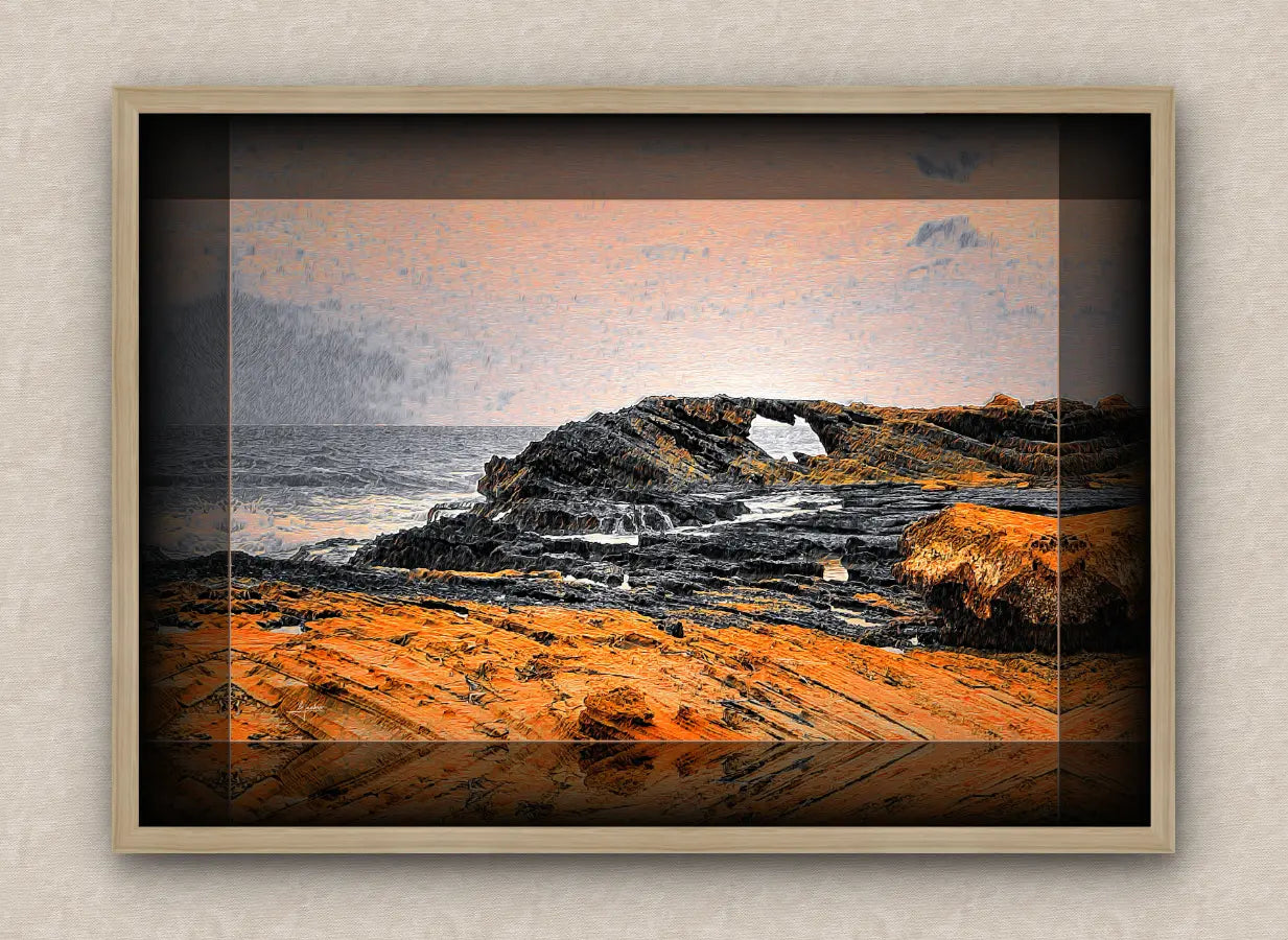 Oak framed artwork of a maritime landscape with rocks and ocean.