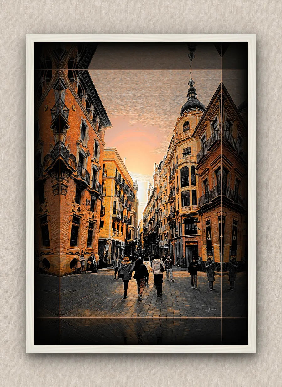 Cityscape artwork of a narrow pedestrian street crowded during sunset; in warm tones, with dark border and white frame.