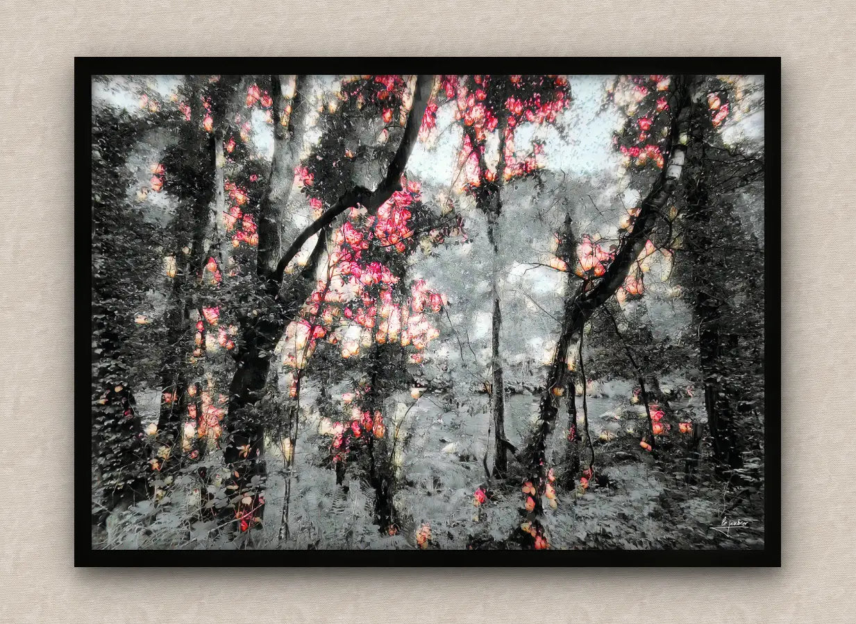 Winter scene wall art framed in black featuring a snowy forest with lush vegetation