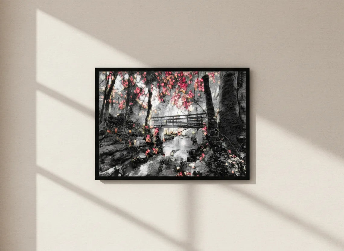 Winter scenery artwork featuring a snowy forest with a bridge over a river on a beige wall