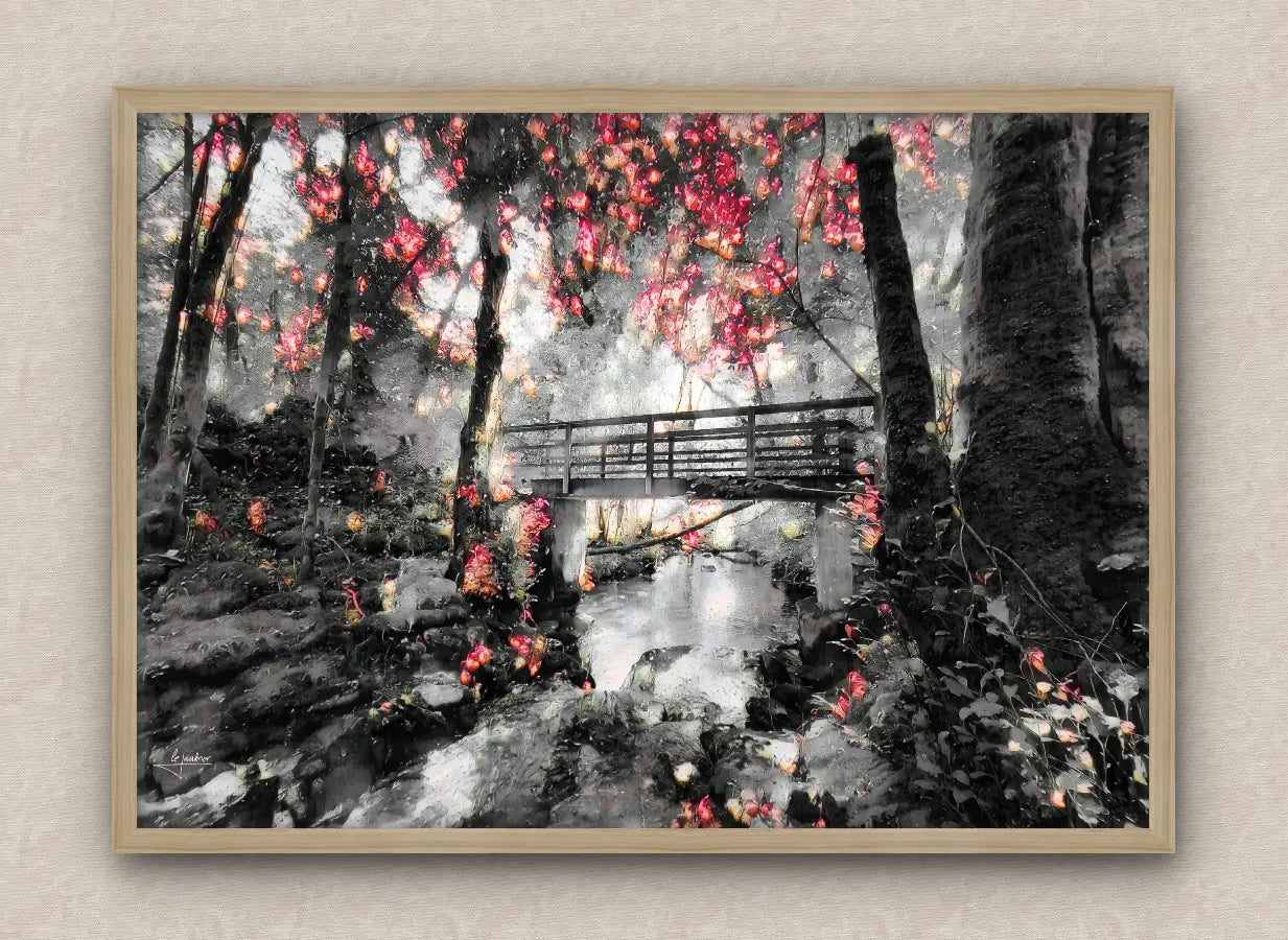 Winter scene wall art framed in oak featuring a snowy forest with lush vegetation and a bridge over a stream