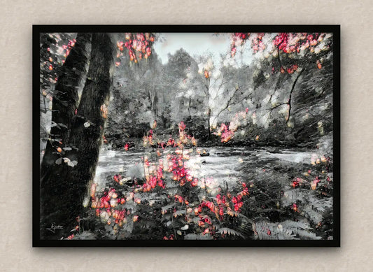 Winter scene wall art framed in black featuring a snowy forest with lush vegetation and a river