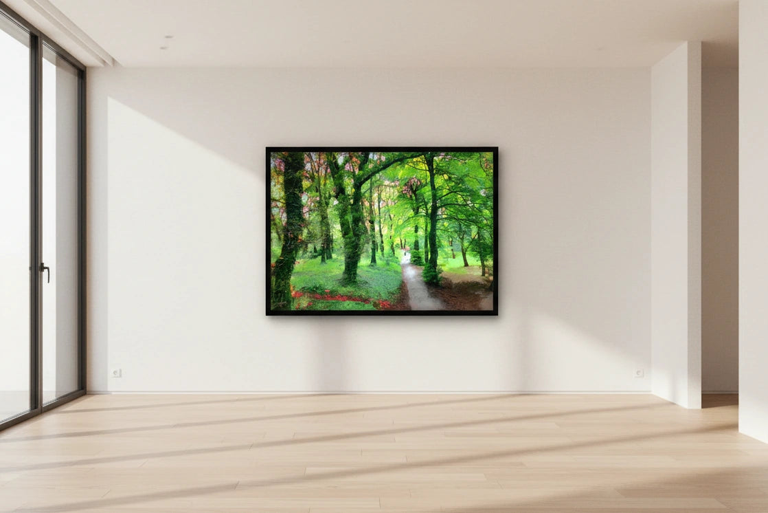 Framed artwork of a forest landscape on a beige wall in a modern room with a sofa and a coffee table