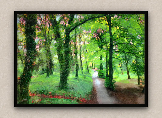 Wall artwork consisting of an impressionist painting with a lush green forest and a path, framed in black